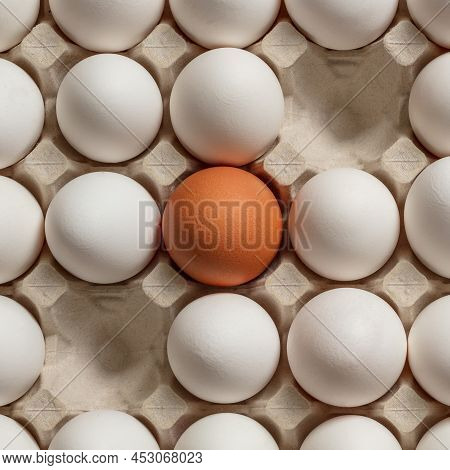 Chicken Eggs Brown And White In A Tray. Some Slots In The Tray Are Empty. View From Above.