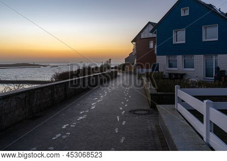 Helgoland, Germany - 02.27.2022: Frozen Footprints On A Concrete Pathway By The Sea In German Island
