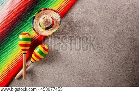 Cinco De Mayo Holiday Background Made From Maracas, Mexican Blanket Stripes Or Poncho Serape And Hat