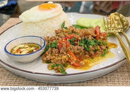 Stir Fried Thai Basil With Minced Pork And A Fried Egg On Topped Rice