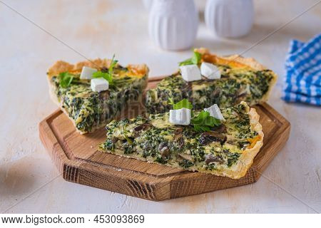 Unsweetened Sliced Open Pie, Shortcrust Pastry Quiche Stuffed With Spinach, Mushrooms And Cheese On 