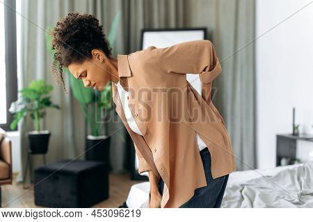 Upset Frustrated African American Young Woman Suffering From Backache, Unhappy Mixed Race Brunette G