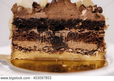 Close Up Of Hulf Of Chocolate Bento Cake. Presentation Cake On Easter Bunny Stand. Cake In Section