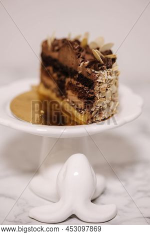 Hulf Of Chocolate Bento Cake. Presentation Cake On Easter Bunny Stand. Cake In Section