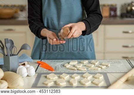 Cooking Central Asian Baursaks By A Chef In A Modern Kitchen.