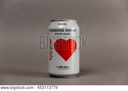 Tin Can With Drinking Water. Freshwater For Residents Of Ukraine. Belgian Brewery Ab Inbev Provides 