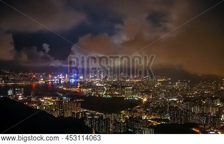 Cityscape Aerial View Of Hong Kong Under Cloudy Sky At Night Luxury Travel Adventure Tourism Lights 