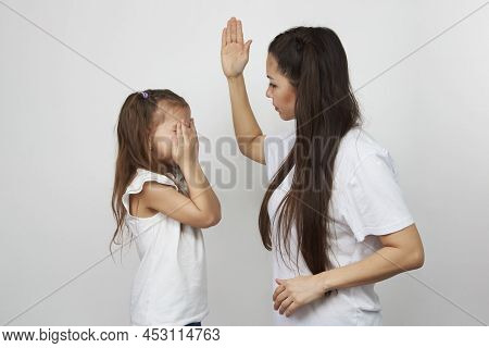 Young Mother Scolds Her Child Girl