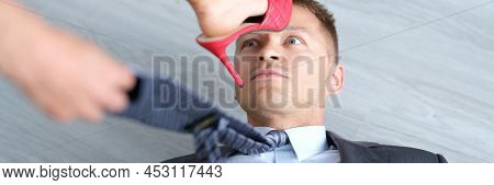 Woman Foot In High-heeled Shoes Stands On Man Head. Domination Of Women Over Men Concept