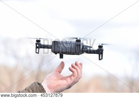 10 April 2022 - Krakow, Poland: Man Man Catches Drone Parrot Anafi Thermal In His Hand After The Fli