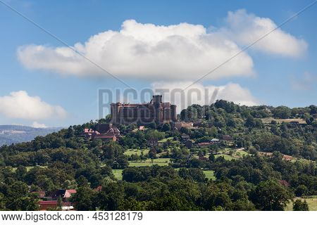 Castle Chateau De Castelnau-bretenoux Surrounded By Cultivated Farmland, Areas Of Dense Forest On Hi
