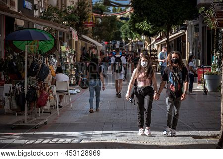 Nicosia, Cyprus - June 26, 2021: People Wearing Facemasks Walking By Ledra Street