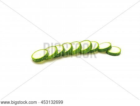 Row Of Fresh Cut Slices Of Luffa Smooth Sponge Loofah Fruit Isolated On White Background