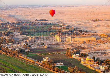 Hot Air Balloon Flying Above The Mortuary Temple Of Ramesses Iii At Medinet Habu In Theban Necropoli