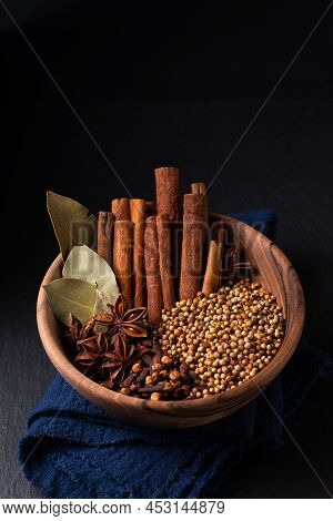 Food Ingredient Thai Five Spice In Wooden Bowl On Black Slate Stone Board With Copy Space