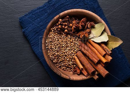 Food Ingredient Thai Five Spice In Wooden Bowl On Black Slate Stone Board With Copy Space