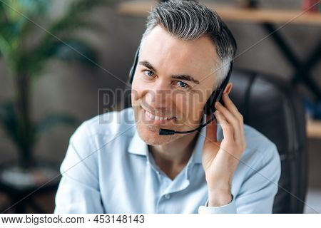 Portrait Of A Smiling Confident Middle Aged Caucasian Office Worker Working Remotely, Office Manager