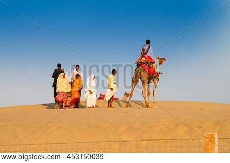 Thar Desert, Rajasthan, India - October 15th 2019 : Tourists Riding Camels, Camelus Dromedarius, At 
