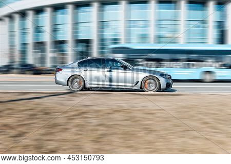 Car Bmw 530i On The Asphalt Road In Motion. Bmw 5 Series G30 Moving On The Street In City. Moscow, R