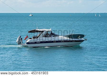 Airlie Beach, Whitsundays, Queensland, Australia - April 2022: A Powerful Motor Boat With Fishers Of