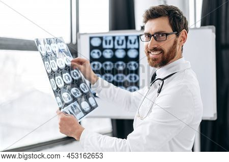 Smart Professional Proud Caucasian Doctor In A Medical Uniform, With Glasses, A Pulmonologist, A The