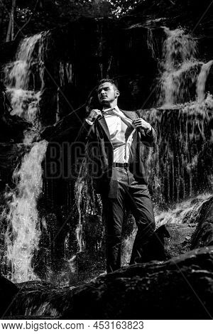 Profit Business Concept. Businessman Undressing At Waterfall Ready To Swim. Great Finance Waterfall.