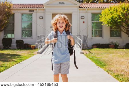 Child Pupul With Rucksacks In The Park Near School. Schoolboy With Backpacks Outdoors. Knowledge Day