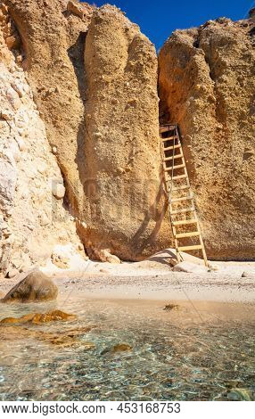 Idyllic Tsigrado beach surrounded by beautiful cliffs on Greek island of Milos