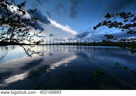 Beautiful Late Afternoon Cloudscape Over Pine Glades Lake In Everglades National Park, Florida Refle