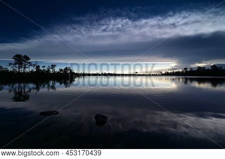 Beautiful Late Afternoon Cloudscape Over Pine Glades Lake In Everglades National Park, Florida Refle