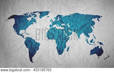 Crumpled Paper In Shape Of Map Of World Isolated On White Background.