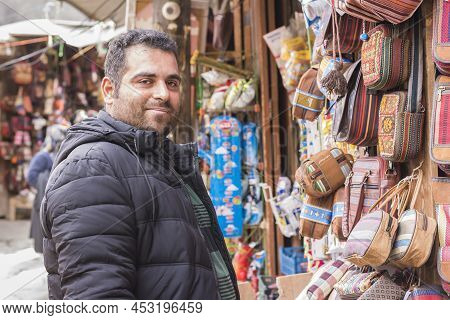 Masuleh, Iran - December 22, 2017 Young Man At Souvenir Shop. Gilan Province