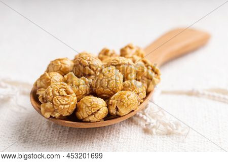 Caramel Popcorn In Wooden Ladle