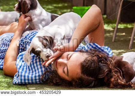 Beautiful Young Girl Having Fun With Her Small French Braque Puppies