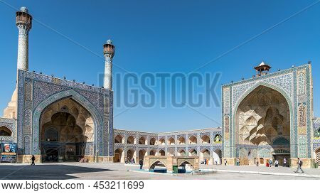 Isfahan, Iran - May 2019: Tourists Visiting Jameh Mosque Of Isfahan