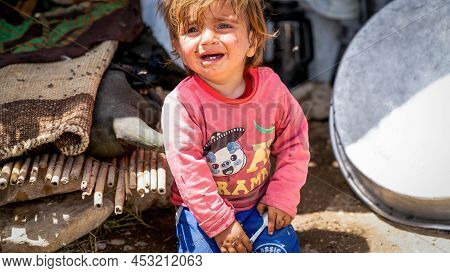 Shiraz, Iran - May 2019: Qashqai Turkish Nomadic Child Crying In A Nomad Camp. Qasqhai Are Nomadic P