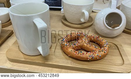 Sweet Bun, Bagel With Sprinkles For Tea. Dessert Served On The Table