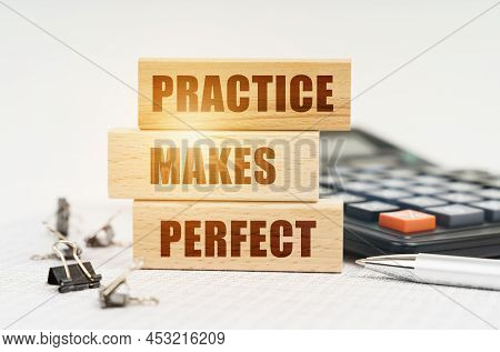 Business And Finance Concept. On The Reports Is A Pen, Calculator, Clips And Wooden Boards With The 