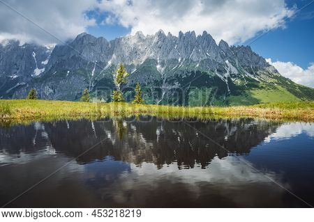 Mountain Pond With Wilder Kaiser Range Reflecting In Water Pond, Tirol - Austria