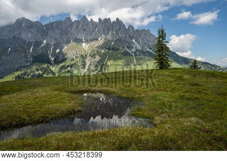 Mountain Pond With Wilder Kaiser Range Reflecting In Water, Tirol - Austria