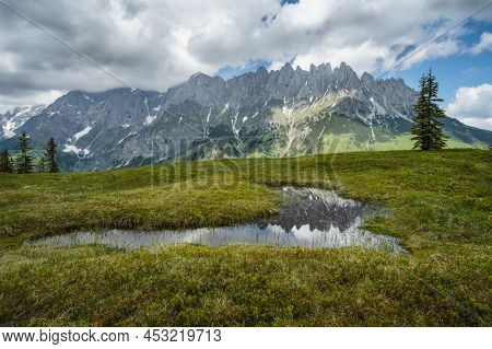 Mountain Pond With Wilder Kaiser Range Reflecting In Water, Tirol - Austria