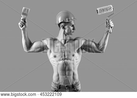 Painting Has Never Been This Easy. Muscular Painter Hold Paintroller And Paintbrush. Painting