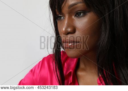 Thougtful African American Woman Looking Aside Isolated On White Wall.