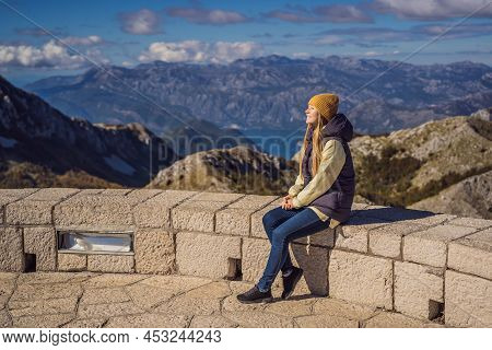 Woman Traveller In Mountain Landscape At National Park Lovcen, Montenegro. Travel To Montenegro Conc