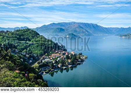 Varenna, Italy - April 15, 2022: Como Lake And Town Of Varenna Waterfront, Lombardy Region Of Italy