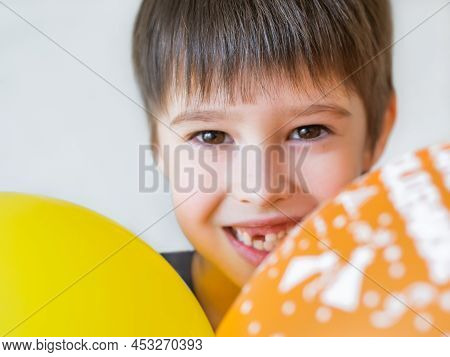Smiling Kid Shows Hole In Row Of Teeth In His Mouth. One Incisor Fell Out Just Now. Happy Child With