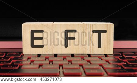 Eft A Word On Wooden Cubes On The Illuminated Laptop Keyboard.
