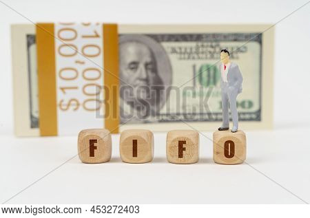 Business And Finance Concept. On A White Surface Are Cubes With The Inscription - Fifo. On The Cube 