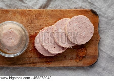 Homemade Jagdwurst On A Rustic Wooden Board, Top View. Flat Lay, Overhead, From Above.