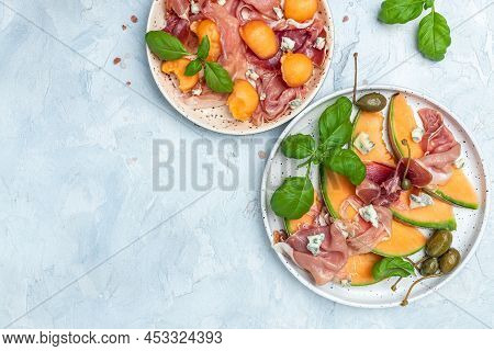 Fresh Melon With Prosciutto And Basil. Antipasti, Traditional Spanish And Italian Appetizer. Top Vie